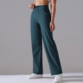 Detail view of high-waist dark teal wide-leg yoga pants with functional side pockets - S / Dark Teal - Extended