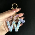 Resin letter W keychain with colorful heart sequins, purple tassel, and butterfly charm - Letter W / Butterfly Tassel 8-Shape Buckle