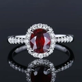 Silver halo ring with red oval gemstone and pavé diamonds, set against black background - Platinum Red Diamond Precision Ljz-28 / Adjustable Open