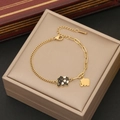 Close-up of golden elephant charms with black enamel details on adjustable bracelet - Elephant Style (4#)
