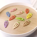 Colorful carrot-shaped resin hair clips for children displayed on a wooden tray - Random Mixed Colors