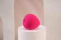 Pink teardrop makeup sponge on white base for dry and wet cosmetic application - Porous Pink Waterdrop