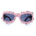 Pink punk sunglasses featuring silver rivet piercings and textured designer frames - Lotus Pink