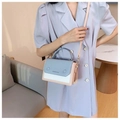 Detail of color-block leather bag with logo print and adjustable shoulder strap - Blue