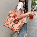 Detail of soft coral canvas tote bag with artistic cat and rabbit illustration print - Cat's Day