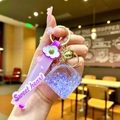 Purple quicksand keychain with sweet heart strap and diamond-shaped star filled charm - Purple Luminous Bubble Dice