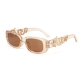Detail of champagne oval sunglasses featuring a golden dragon-shaped metal temple design - Handmade Items Ship In 3-4 Days / Multicolor Gradient