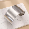 Macro shot of silver wide open cuff bracelet showing brushed metal texture and modern finish - Brushed Finish / B44 Silver Color