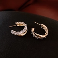 Golden C-shaped hoop earrings with sparkling clear crystals and twisted metal design - Twisted Geometric Pave / Gold