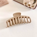 Matte khaki resin shark hair claw clip for thick hair shown on minimalist background - Light Coffee