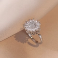 Macro shot of silver sunflower ring with shimmering cubic zirconia on silk fabric - J0034 Steel Color --2