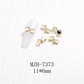 3D bow nail art charm with white cat eye stone and gold base, size 11x6mm, model MZH-7373 - Gold Edge Milky White Cat's Eye Bow (MZH-7373) / 11*6mm