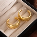 Polished gold chunky hoop earrings displayed in a luxury beige velvet jewelry box - Gold Wide C-Shape