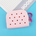 Pink silicone hole pattern coin purse with plastic hook on blue background - Pink