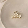 Golden hair claw clip with cream flower accents and pearls in a ceramic dish - Small / Off White