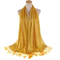 Bright yellow shawl with metallic gold thread finish and tassel trim on white mannequin - Turmeric
