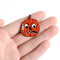 Macro shot of Halloween pumpkin enamel pin showing vibrant orange color and metal details - Pumpkin with Pipe (XZ2394)