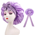 Detail of purple satin sleep bonnet showing silk texture and long adjustable ribbon straps - Cross-Light Purple