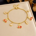 Detail of gold cherry charm bracelet with red zircons and adjustable lobster clasp closure - Red Cherry Teardrop Zircon Style (B1774)