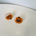 Close-up of orange glittery pumpkin hair clips for Halloween hair styling and accessories - Little Pumpkin Green