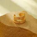 Detail of 18k gold plated stainless steel multi-layer ring with rope texture and 1.4cm width - Multi-Layer Twisted Rope Bead Gold