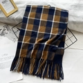Classic blue and brown checkered scarf with fringe on a minimalist display stand - Navy Coffee