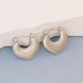 Detail of silver irregular geometric earrings with textured dot pattern on stone pedestal - Silver Style K7-40