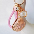 Macro view of pink enamel shell keychain with rhinestones, pearls, and woven leather cord - Heart Lanyard / Pink