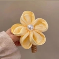 Floral hair scrunchie in soft yellow with a white pearl and brown spiral elastic band - Yellow Flower Telephone Wire Hair Tie