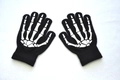 Detail of glow-in-the-dark skeleton bone print on black knitted fingerless gloves for kids - Skeleton Claw / Full Finger