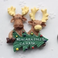 Resin souvenir fridge magnet featuring Niagara Falls Canada with cute cartoon elks - Niagara Falls Canada Moose