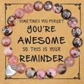 Pink and black natural stone beaded bracelet with a silver heart pendant on a gift card - Rhodonite + reminder Card