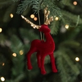 Red flocked reindeer Christmas ornament with golden glitter antlers hanging on tree - Red Reindeer