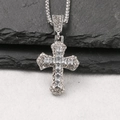 Macro detail of silver cross pendant with sparkling zircons on dark textured rock surface - White / Box Chain 60cm