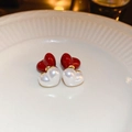 Detail view of heart-shaped pearl earrings with gold and red accents on ceramic - Red White Heart (S925 Silver Needle)