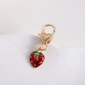 Detailed view of a gold-plated strawberry pendant with heart lobster clasp on white background - Small Strawberry