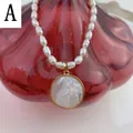 Freshwater pearl necklace with golden Virgin Mary shell pendant on red textured glass - Style A-Round Virgin Mary Relief