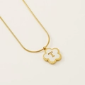 Gold clover necklace with white petal inlay and letter T pendant on a sleek snake chain - Letter T