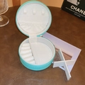 Portable mint green round faux leather travel jewelry box with dividers and ring slots - Blue