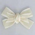 Close-up of cream-white faux linen ribbon bow with elegant wavy edges and mesh texture - Finished Bow