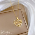 Detail view of gold heart necklace with Mama pendant and dimensions on silk backdrop - Gold Heart Mama Pendant (G348)