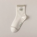 Off-white crew socks with olive green contrast and a cute avocado embroidery - Foot Sole Letter