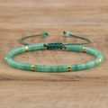 Close-up of adjustable hand-woven green natural stone bracelet with gold metal spacers - No.5 Green Aventurine