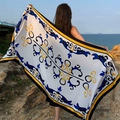 Detail of a rectangular polyester beach shawl with blue and yellow floral prints on the coast - White Base Blue Yellow Scrolling (Retro Scrolling Grass-13)