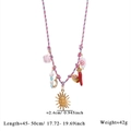 Detail view of Bohemian woven necklace featuring sun, evil eye, and crystal charms - Style 3 (Multicolor Woven Rope Multi-charm Necklace)