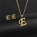 Detailed macro view of gold-plated stainless steel letter E necklace and earrings set - Letter E / Gold
