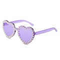 Detail of purple heart-shaped sunglasses with shimmering iridescent rhinestones on the frame - New Style / Purple Frame