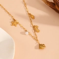 Detail of golden paperclip chain necklace with starfish shell and pearl pendants - Clownfish Beach Necklace (T704)