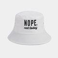 Close-up of cotton sun hat featuring black NOPE not today embroidery on white fabric - One Size / White