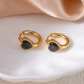 Close-up of gold-plated heart hoop earrings featuring black zircon stones on silk fabric - Heart Zirconia / Black